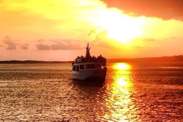 Crabber J II boat at Hilton Head on water at sunset