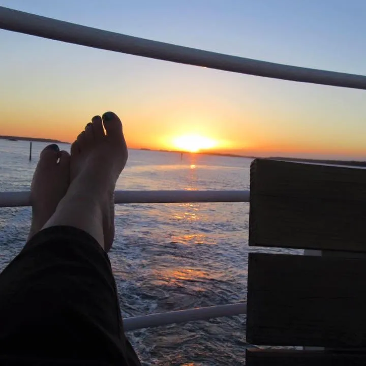 Woman observing sunset from cruise