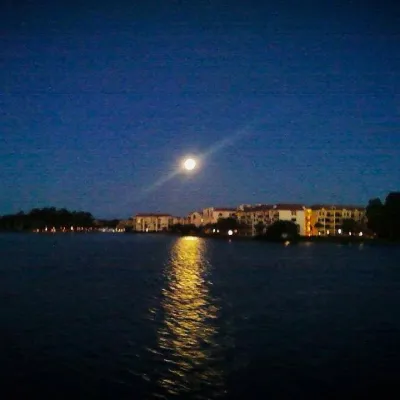 Sun in sky over water