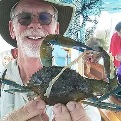 Man showing crab he caught in Hilton Head